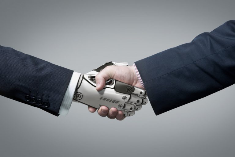 businessman shaking a robot's hand